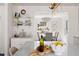 Bright kitchen featuring a marble island and countertops and a dining room in the background at 3800 Wieuca Ne Ter, Atlanta, GA 30342