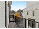A spacious balcony features wood decking and black metal railings with autumn trees in the background at 574 Boulevard Ne Pl # 14, Atlanta, GA 30308