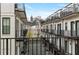 Balcony overlooks an inner courtyard, offering a private outdoor space with black metal railings at 574 Boulevard Ne Pl # 14, Atlanta, GA 30308