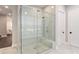 Modern bathroom with a glass shower, a soaking tub, and white marble flooring at 574 Boulevard Ne Pl # 14, Atlanta, GA 30308