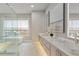 Bright bathroom with double vanity, soaking tub, and spacious glass shower at 574 Boulevard Ne Pl # 14, Atlanta, GA 30308