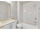 Bathroom featuring a shower over tub and a white vanity with a marble countertop at 574 Boulevard Ne Pl # 14, Atlanta, GA 30308