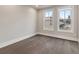 A spacious bedroom with hardwood floors and natural light from two windows at 574 Boulevard Ne Pl # 14, Atlanta, GA 30308