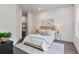 Comfortable bedroom featuring a neutral color palette, tufted headboard, and stylish decor at 574 Boulevard Ne Pl # 14, Atlanta, GA 30308