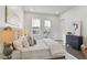 Bright bedroom with a tufted headboard, windows to a balcony, and natural light at 574 Boulevard Ne Pl # 14, Atlanta, GA 30308