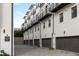 Exterior of modern townhomes featuring black accents and attached garages at 574 Boulevard Ne Pl # 14, Atlanta, GA 30308