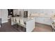 Open kitchen showcases white cabinets, modern island with seating, and stainless steel appliances at 574 Boulevard Ne Pl # 14, Atlanta, GA 30308