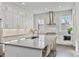 Bright kitchen with white cabinetry, stainless steel appliances and a quartz countertop island at 574 Boulevard Ne Pl # 14, Atlanta, GA 30308