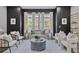 Bright living room featuring large windows, a comfortable sofa, and stylish décor for a relaxing atmosphere at 574 Boulevard Ne Pl # 14, Atlanta, GA 30308