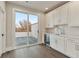 Wet bar featuring white shaker cabinets, a sink, and a beverage fridge at 574 Boulevard Ne Pl # 14, Atlanta, GA 30308