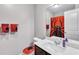 Full bathroom with stylish Spider-Personal themed décor, including towels and toilet seat cover at 6036 Oakley Rd, Union City, GA 30291