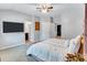 This spacious bedroom includes a TV, carpet, and large bed at 6036 Oakley Rd, Union City, GA 30291