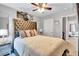 This bedroom has gray walls, a tufted headboard bed and stylish decor at 6036 Oakley Rd, Union City, GA 30291