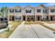 Charming townhouse featuring brick accents and a concrete driveway at 6036 Oakley Rd, Union City, GA 30291