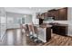 Modern kitchen with granite countertops, stainless steel appliances, and island seating at 6036 Oakley Rd, Union City, GA 30291