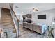 Inviting living area with modern furnishings and view of staircase and kitchen at 6036 Oakley Rd, Union City, GA 30291