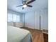 Bright bedroom with hardwood floors, ceiling fan, natural light, dresser, and closet at 2516 Bradford Ne Sq, Atlanta, GA 30345