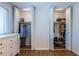 Bedroom closet featuring ample storage space with rods and built-in lighting at 2516 Bradford Ne Sq, Atlanta, GA 30345