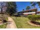 Exterior view of townhouse with lawn and landscaping at 2516 Bradford Ne Sq, Atlanta, GA 30345