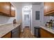 Kitchen area leads to hallway with pantry and stairs, connecting different parts of the home at 2516 Bradford Ne Sq, Atlanta, GA 30345