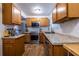 Functional kitchen with stainless steel appliances, granite countertops, and wooden cabinets for storage at 2516 Bradford Ne Sq, Atlanta, GA 30345