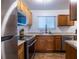 Well-equipped kitchen with stainless steel appliances, wooden cabinets, and a window above the sink at 2516 Bradford Ne Sq, Atlanta, GA 30345