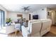 Bright living room features a ceiling fan, and opens up to a dining area and a sliding door to the outdoor space at 2516 Bradford Ne Sq, Atlanta, GA 30345