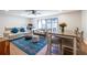 Cozy living room with stylish blue rug, modern furniture, and sliding glass doors opening to the outdoor space at 2516 Bradford Ne Sq, Atlanta, GA 30345