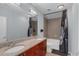 This bathroom features double sinks and tub shower combination with stylish fixtures at 400 W Peachtree Nw St # 2604, Atlanta, GA 30308