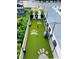 Rooftop dog park with benches, turf, and waste station at 400 W Peachtree Nw St # 2604, Atlanta, GA 30308