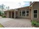 Backyard of house featuring covered patio, wooden deck, and large windows that bring in lots of natural light at 65 Turtle Rock Cv, Acworth, GA 30101