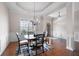 A bright dining room with natural light and a stylish area rug at 65 Turtle Rock Cv, Acworth, GA 30101