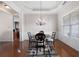An elegant dining room features hardwood floors and a decorative chandelier at 65 Turtle Rock Cv, Acworth, GA 30101