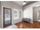 Bright entryway with hardwood floors, natural light, and neutral walls at 65 Turtle Rock Cv, Acworth, GA 30101