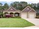 Charming single-Gathering home with a well-manicured lawn and attached two-car garage at 65 Turtle Rock Cv, Acworth, GA 30101