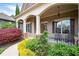 Inviting covered front porch with rocking chairs and decorative landscaping at 65 Turtle Rock Cv, Acworth, GA 30101