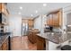 An open kitchen with stainless steel appliances and plenty of counter space at 65 Turtle Rock Cv, Acworth, GA 30101
