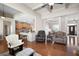 Open concept living space with hardwood floors and access to kitchen and dining area at 65 Turtle Rock Cv, Acworth, GA 30101