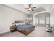 A spacious main bedroom with plenty of natural light at 65 Turtle Rock Cv, Acworth, GA 30101