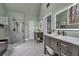 This primary bathroom features dual vanities, a walk-in shower, and a free-standing tub at 931 Cornwall Sw Ct, Marietta, GA 30064