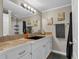 Bathroom featuring a sink with countertop space, a large mirror, and decorative artwork at 931 Cornwall Sw Ct, Marietta, GA 30064