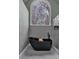 This bathroom features a freestanding tub next to a large, arched window at 931 Cornwall Sw Ct, Marietta, GA 30064