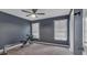 Bedroom showcasing gray walls, two windows with blinds, carpet, and a ceiling fan at 931 Cornwall Sw Ct, Marietta, GA 30064