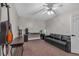 Bedroom with a black sofa, guitar, carpet, and a desk, perfect for relaxation and hobbies at 931 Cornwall Sw Ct, Marietta, GA 30064
