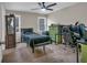 Bedroom featuring neutral carpet, ceiling fan, and windows offering natural light at 931 Cornwall Sw Ct, Marietta, GA 30064