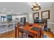 Open floor plan featuring dining table, piano, kitchen with stainless appliances, and barstool seating at 931 Cornwall Sw Ct, Marietta, GA 30064