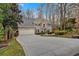 Charming home featuring a two-car garage, a wide driveway, and beautiful architectural details at 931 Cornwall Sw Ct, Marietta, GA 30064