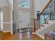 Bright foyer with hardwood floors, staircase, and a large window above the front door at 931 Cornwall Sw Ct, Marietta, GA 30064