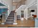 Spacious foyer featuring hardwood floors, staircase, and views to other rooms at 931 Cornwall Sw Ct, Marietta, GA 30064