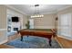 This game room features a traditional style pool table, fireplace, and natural light at 931 Cornwall Sw Ct, Marietta, GA 30064
